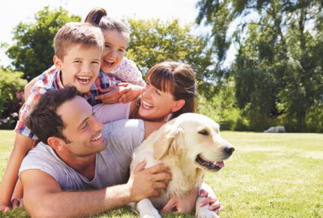 stockphotofamilyrelaxingingardenwithpetdog284520938.jpg