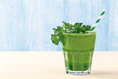 stockphotofreshgreensmoothieonwoodentable441219892.jpg