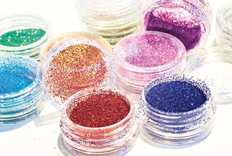 stockphotocollectionofnailglittersofdifferentcolorscloseup518636515.jpg