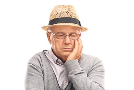 stockphotodepressedseniormansittingonablankpanelandcontemplatingisolatedonwhitebackground460940623.jpg