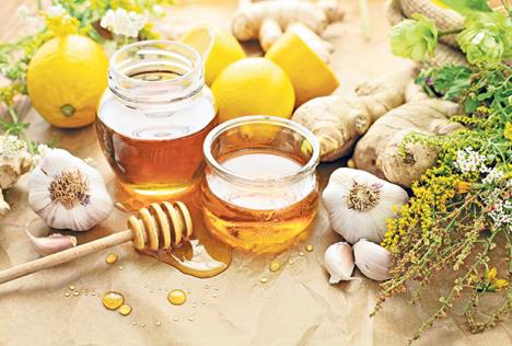 stockphotohoneygarlicherbslemonandgingernaturalmedicinehealthyfood712052494.jpg