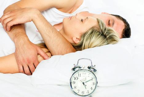 stockphotoyoungcoupleinbedwithfocusinalarmclock37211755.jpg