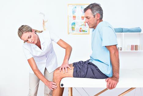 stockphotodoctorexaminingherpatientkneeinmedicaloffice289401218.jpg