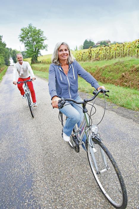 stockphotoseniorcoupleridingbicycleincountryside155791724.jpg