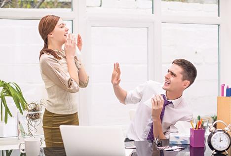 stockphotoyoungsickofficemanagerstandsattheofficenearhercolleagueandsneezes641884765.jpg
