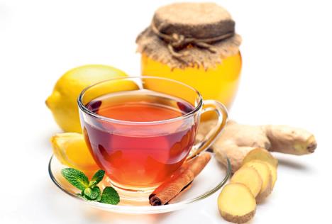 stockphototeahoneygingercinnamonandlemononawhitebackground567692491.jpg