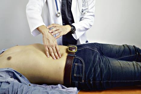 stockphotothedoctorisexaminingthepatientsstomachabdominalpaingastriculcerappendicitis1010277430.jpg