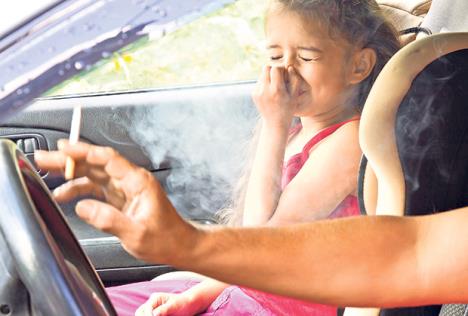 stockphotostopsmokingforchildrenfathersmokingcigaretteandthechildchokingofsmokeinacar632534621.jpg