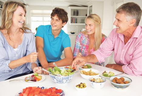 stockphotofamilyenjoyingmealathome84198496.jpg