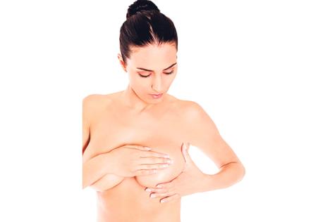 stockphotoyoungwomanexaminingherbreast521719042.jpg