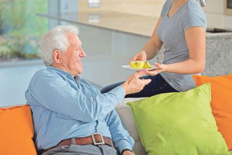 stockphotocloseupofcaringdaughtergivingillgrandpaapple233804101.jpg