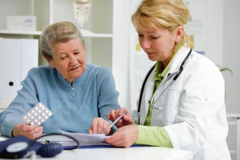 stockphotodoctorprescribesmedicationtotheseniorpatient145621852.jpg