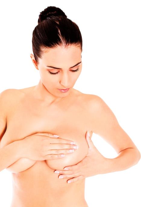 stockphotoyoungwomanexaminingherbreast521719042.jpg