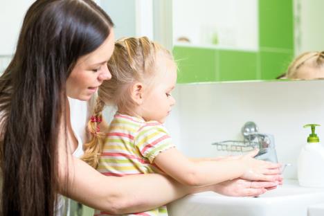 stockphotokidgirlandmotherwashinghandswithsoapinbathroom557307283.jpg