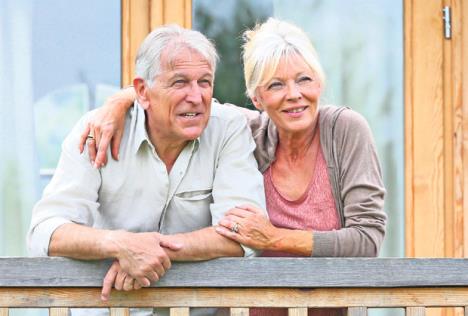 stockphotoseniorcouplestandingoustidelogcabinincountryside219082408.jpg