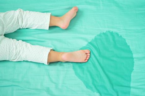 stockphotokidsfeetandpeeinamattresslittlegirlfeetandpeeinbedsheetonthemorningchild508689409.jpg