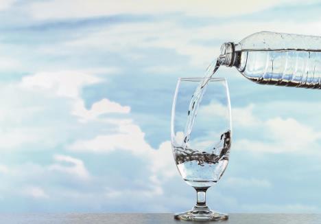 stockphotoglassofwatheronthetableskybackground665368264.jpg