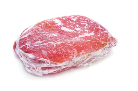 fraj-stockphotosomeslicesoffrozenmarinatedporksirloinwrappedinplasticwraponawhitebackground174686048.jpg