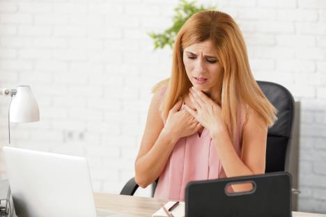 stockphotowomanhavingpanicattackatworkplace1215235516.jpg