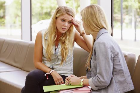 stockphotodepressedcollegestudenttalkingtocounselor284570321.jpg