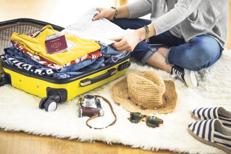 stockphotopreparationtravelsuitcaseathome606802250.jpg